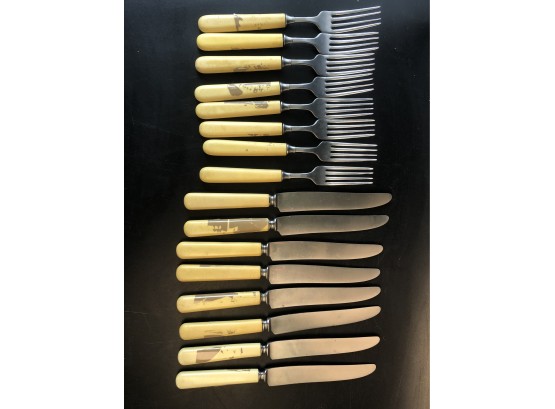 8 Yellow Handled Stainless Knives & Forks