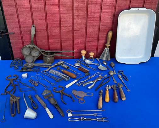 Lot 76- Primitive Kitchen Tools & White Enamel Pan- Can Openers- Biscuit Cutter- Tea Strainers- Crimper- Olive