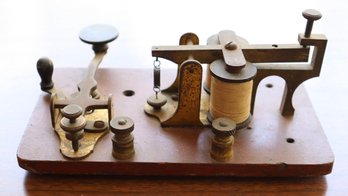 Lot 101- Antique Morse Code Telegraph Key Dark Wooden Base