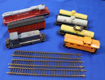 Lot 144- 1970 Vintage 10 Piece HO Train Lot With Tracks - Burlington Engine - Caboose