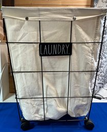 Lot 616 - Rae Dunn Laundry Basket On Wheels - Wire Cart With White Liner