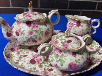 Lot 25- Vintage Chintz Pink Floral Tea Set - Creamer, Sugar, Tea Pot And Tray