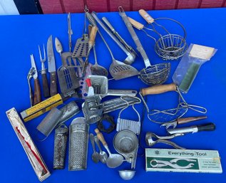 Lot 404- Antique Kitchen Utensils - Cheese Grater - Butter Cutter- Nutmeg Grinders- Strainers- Cups- Food Mill