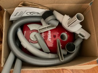 Lot 499- Eureka! Euro Pro Shark Plus Canister Vacuum - Nearly New