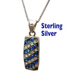 Lot 319 - Sterling Silver Royal Blue And Crystal Clear Rhinestone Pendant And Necklace