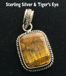 Lot 329 - Sterling Silver And Tiger's Eye Pendant