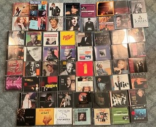 Lot 73- CD Collection - Jazz - Christmas - Jimmy Buffet - Eric Clapton - Rod Stewart And More