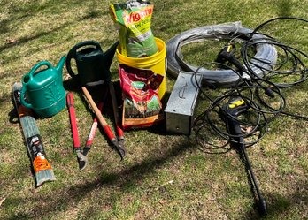 Lot 38- Garden Lot - Have A Hart Trap Cage - Stakes - Grub X - Watering Cans- Clippers Etc