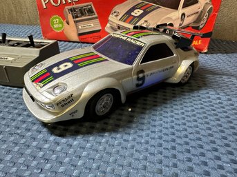 Lot 429- Porsche 928 Remote Control RC Car - Radio Shack - Includes Instructions - 1/16 - With Box