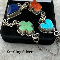 Lot 254- Sterling Silver Reversible Bracelet - Lapis- Coral- Turquoise Heart Cross