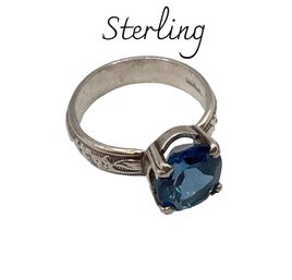 Lot 134RR- Sterling Silver Ring Sz 6.5 Blue Oval Stone 4 Prongs Engraved Band Stunning Sapphire Look Alike