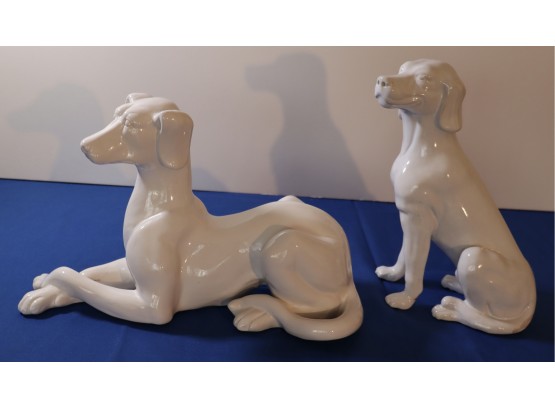 Lot 432- 2 Twentieth Century White Glazed Bisque Ceramic Hound Dog Statue Figurines