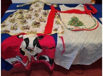 Lot 251 - Collection Of 4 Vintage Aprons  - Christmas Cow - Country