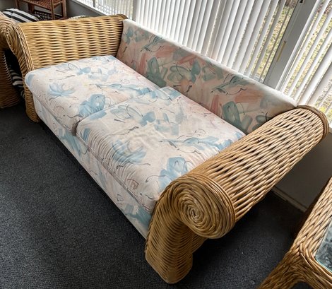 Woven Rattan Loveseat With Floral Cushions
