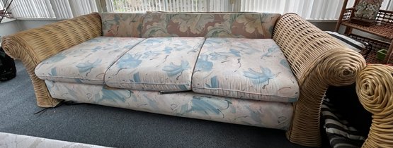 Woven Rattan Sofa With Floral Cushions