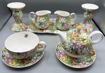C. Holding Bermuda Island Flowers Pattern Tea Set - 9 Pieces Total