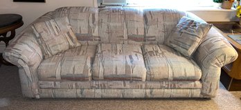 Cushioned Sofa With Two Throw Pillows