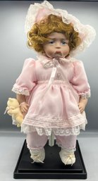 Cardinal Inc Dynasty Doll Collection - Porcelain Doll With Stand - Upset Baby