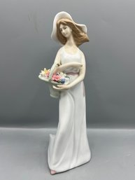 Porcelain Lady With Flower Basket Sculpture