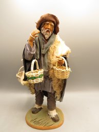 Man Carrying Baskets Figurine