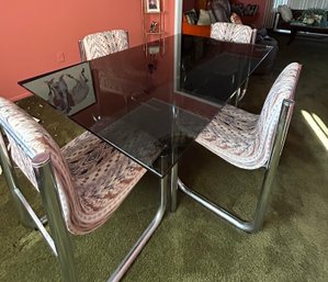 Chrome And Smoke Glass Dining Table With 4 Upholstered Chrome Chairs