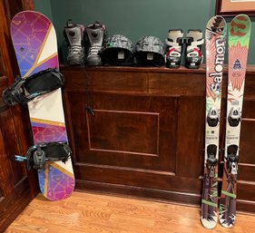 Kids Roxy Snowboard, Salomon Shotgun Skis, Dalbello & Salomon Snow Boots & Giro Helmets - 8 Pieces