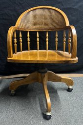 Solid Oak Cane Back Swivel Office Chair On Casters With Curved Back
