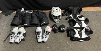 Lot Of Protective Childs Lacrosse Pads And Helmet