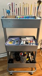 Wire Mesh Rolling Utility Cart With Assorted Paints And Brushes