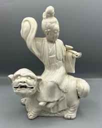 Asian Figurine Gloss White Ceramic Statue Of Quan Yin Sitting On Shishi Lion Dog