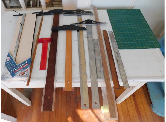 Assorted Rulers, T Squares, And Vinyl Matt Cutter