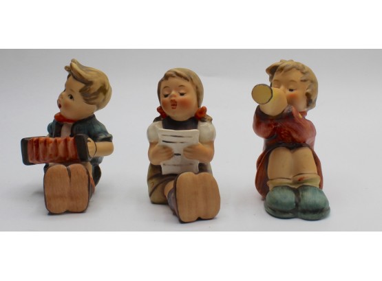 Hummel #390 'Boy With Accordion', #389 'Girl With Sheet Music' & #391 'Girl With Trumpet' Figurines