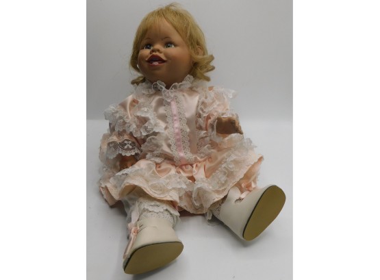 Sitting Baby Girl Doll In Pink Dress
