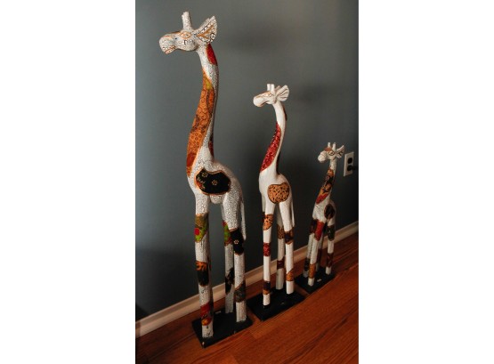 3 Wooden Decorative Giraffes - 1 L7.5' X H39' - 2 L8' X H33' - 3 L6' X H24' -