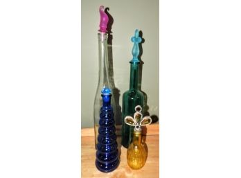 Assorted Set Of 4 Glass Bottles With Toppers