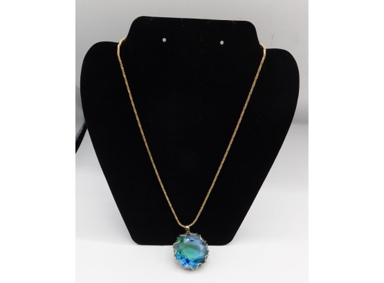 Stylish Blue Gemstone Pendant With Gold Tone Necklace