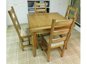 Solid Wooden Table With Fold Out Leaves And 4 Matching Woven Seated Chairs