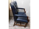 Studded Tufted Blue Leather Chair With Wooden Arms