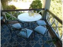 Vintage Wrought Iron Patio Set With Round Glass Top Table And 6 Chairs With Blue Cushions