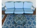 Vintage  Sofa With Blue Seat Cushions And Round Glass Top Table Seats 3