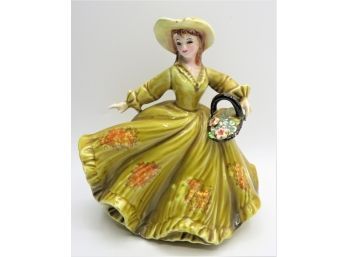 Pretty Ceramic Woman Figurine/planter Wearing Dress & Carrying A Basket Of Flowers