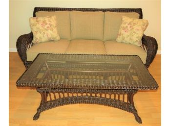 Fabulous Wicker Sofa 2-throw Pillows And Glass Top Coffee Table