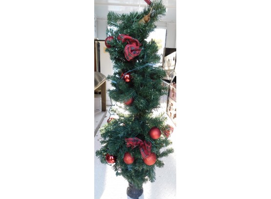 Faux Lighted Holiday Style Christmas Tree In Plastic Stand