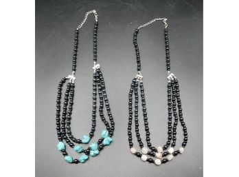 Pair Of Black Beaded Necklaces - 1 With Blue Stones And 1 With White Stones