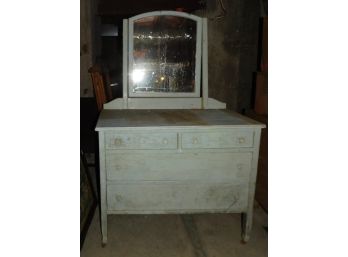 Vintage Solid Wood Four Drawer Dresser With Attached Mirror On Caster Wheels