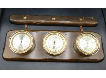 Thermometer Barometer Hygrometer On Wooden Backing