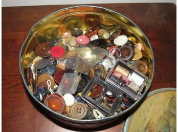 Assorted Vintage Buttons Inside A Metal Tin