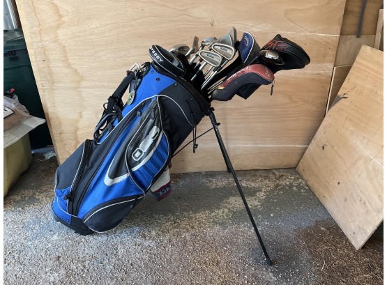 Ogio Blue Golf Bag With Assorted Golf Clubs