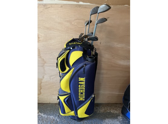 Michigan Blue And Yellow Golf Bag With Assorted Golf Clubs
