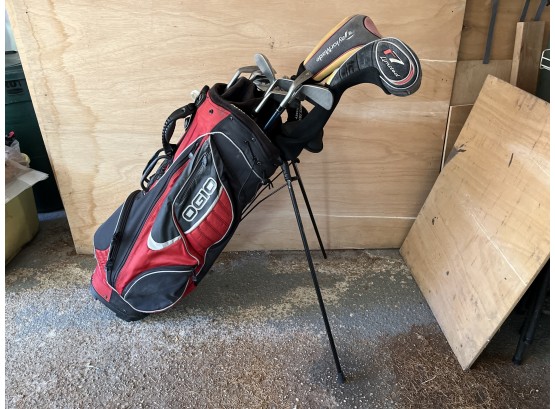 Ogio Red Golf Bag With Assorted Golf Clubs